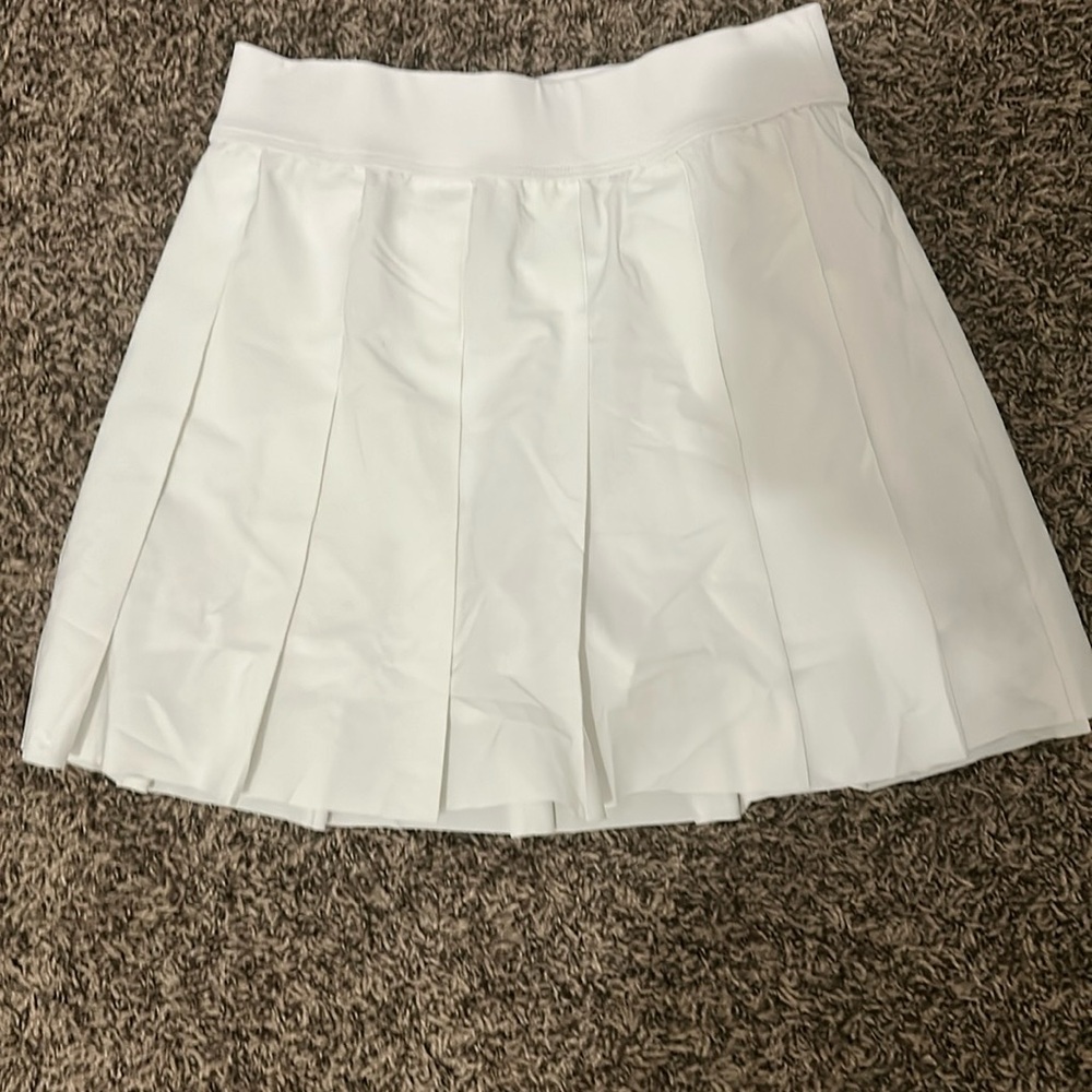 White pleated fabletics skirt with spandex inside